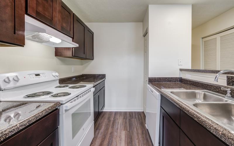 a kitchen with white appliances